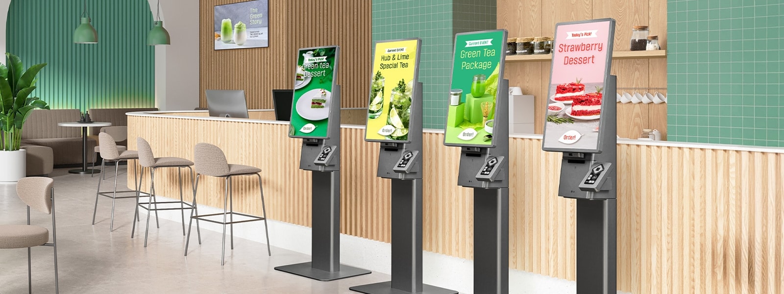 Row of LG freestanding self-ordering kiosks in a modern cafe