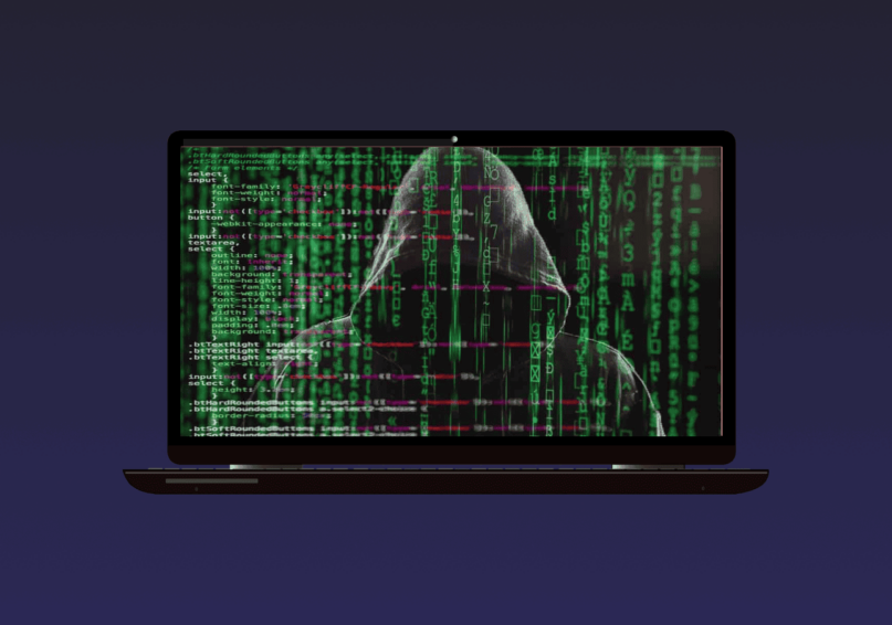 opened laptop, showing a hooded man surrounded by letters in green and a short strip of code on the screen.