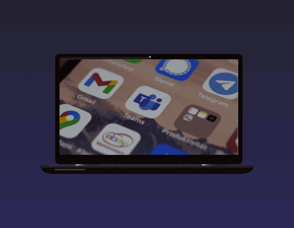 opened laptop showing a phone screen with logos of different applications